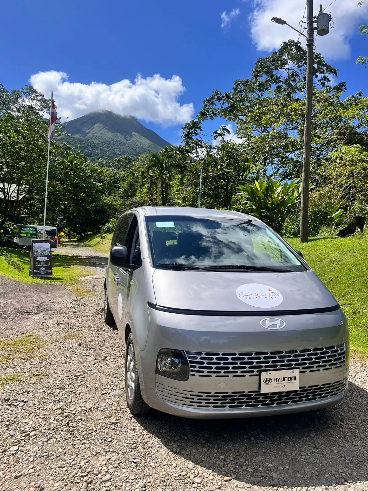 Can't Wait Travel van with Arenal Volcano in the background