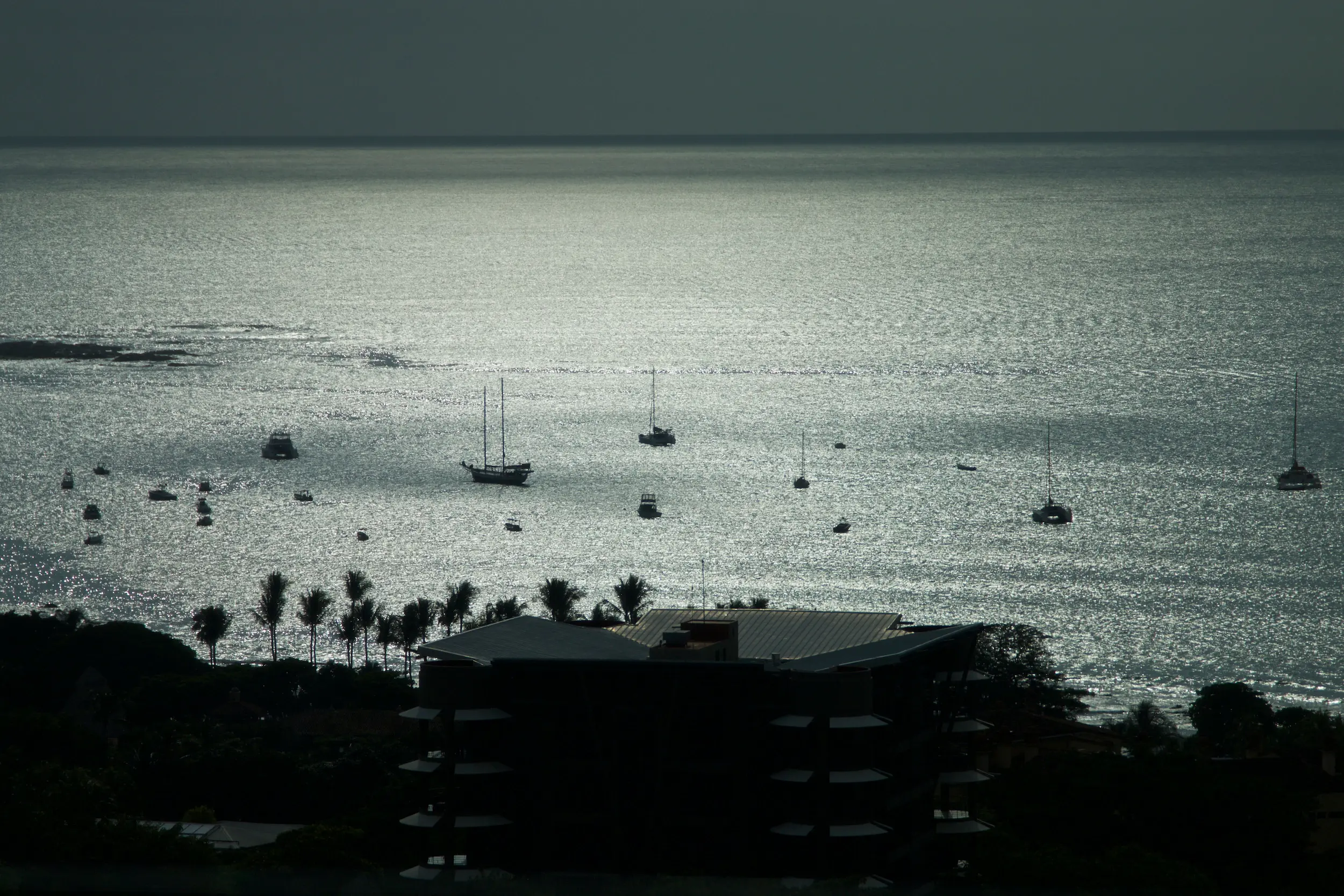Boats anchored in Tamarindo bay at dusk, Guanacaste, Costa Rica